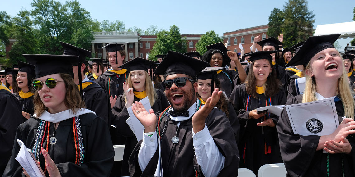 students celebrating at graduation