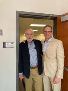 Professor of Business Emeritus Galen deGraff stands with Rob Strassheim '96 in the doorway of the newly named Galen deGraff Classroom in Woodward Hall. Photo courtesy of Rob and Sarah Strassheim. 