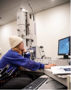Student Kristine Dadufelza works in UMW’s Jepson Science Center with the electron microscope gifted to the University by Irene Piscopo Rodgers. Photo by Tom Rothenberg.