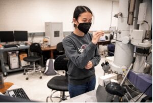 UMW student Boramy Meng works with the transmission electron microscope Irene Piscopo Rodgers gifted to Mary Washington in 2004. Having made a name for herself in the field of electron microscopy, Irene trained UMW faculty and students to use the instrument. Photo by Tom Rothenberg.