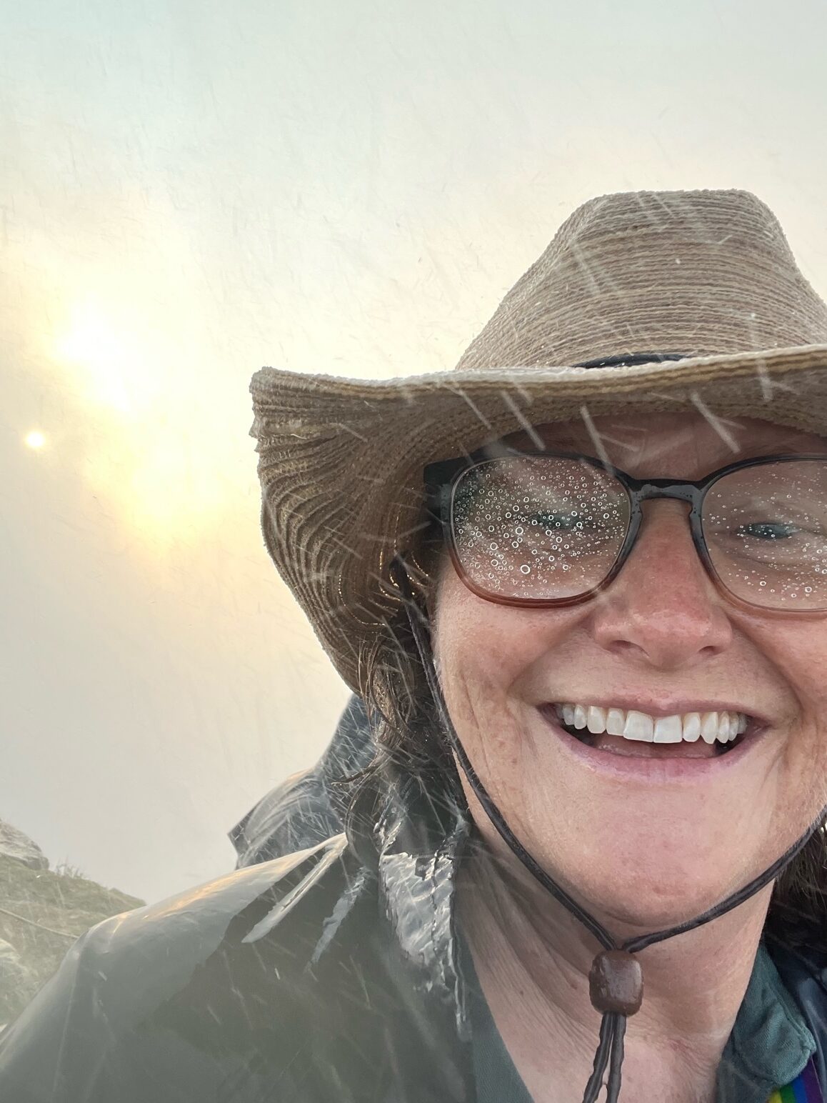Sally smiles during a rainstorm in Africa. Photo courtesy of Sally Brannan Hurt.