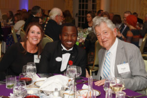 From left: Daryl-Sue Mueller, UMW sophomore Aloysius Kabonge, and Hunter Morin at the Celebration of Giving. Photo by Karen Pearlman Photography.