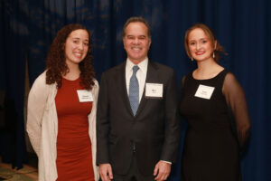 Seniors Sofia Taylor (right) and Hannah Stottlemyer, who both earned full-ride Alvey Scholarships established by Irene Piscopo Rodgers, pose with Ron Pohl, Irene's friend and attorney, at the 2023 Celebration of Giving. Photo by Karen Pearlman Photography.