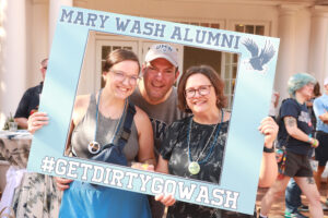 Rob '93 and Dodie Denison Whitt '95 (seen here with daughter Emily, a 2023 graduate, at Homecoming last October) are sponsoring a challenge for Mary Washington alumni who are married to fellow alumni. When 100 gifts are made by alumni couples, the Whitts will unlock a $5,000 gift to the Fund for Mary Washington. Photo by Karen Pearlman. 