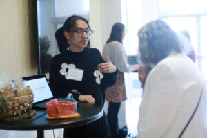 Junior Maha Momtaz, a studio art major at Mary Washington, shares her artwork with a donor at the Student Showcase. Maha is the recipient of the Lettie Pate Whitehead and the Nina G. Bushnell scholarships. Photo by Karen Pearlman.