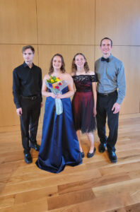 Sofia (second from left) with cellist Riley Francis (left), flautist Madeline MacArthur, and Assistant Professor of Music Robert Wells (right) after her senior vocal recital in the Weatherly Wing in Seacobeck Hall. Photo courtesy of Sofia Taylor.