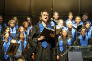 Sofia rehearses with UMW's combined choirs. Receiving a full-ride Alvey Scholarship gave her the chance to minor in music and neuroscience, in addition to her psychology major, and perform with the UMW choirs and UMW Theatre. Photo by Tom Rothenberg.