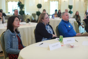 Vice President for Advancement and Alumni Engagement Katie Turcotte (center), who conceived of the Fund for Mary Washington Impact Grant program, listens along with Alumni Board members Charmayne Staloff '05 and Brendan Kelly '95. Photo by Karen Pearlman.