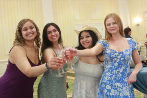 Friends from the Class of 2024 toast to the last four years and their futures. Photo by Karen Pearlman.