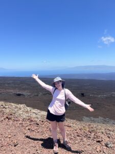 On the faculty-led trip to the Galápagos Islands, Madeline poses over Sierra Negra, a shield volcano, on the island of Isabela. Photo courtesy of Madeline Brunt.