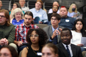 SSI participants, alumni, faculty members, and guests asked questions of presenters about their research during the symposium. Photo by Karen Pearlman.