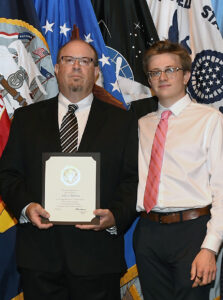 Anders (right) and his father, John Barretta '90, who earned his bachelor's degree in geography from Mary Washington. Professor Marshall Bowen inspired John's 30-year career as a geospatial intelligence officer, Anders said. Photo courtesy of John Barretta.