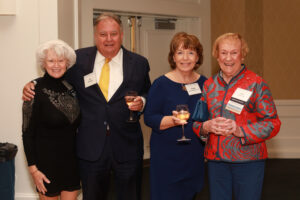 From left: Dr. Terrie Young Crawley '77, Al Merchent, Cindy Jones Merchent '77, and Rita Morgan Stone '52 pose for a photo during the cocktail hour. Photo by Karen Pearlman.