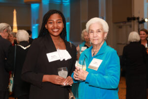 Kaylah Lightfoot '25 poses for a picture with Lucy Lutterbie '70 during the cocktail hour. Photo by Karen Pearlman.