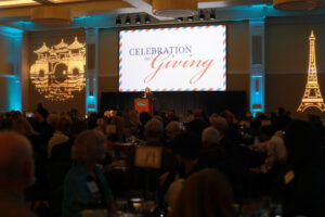 Vice President for Advancement and Alumni Engagement Katie Turcotte quoted late chef and globetrotting TV host Anthony Bourdain as she welcomed donors to the 2024 Celebration of Giving, held in the Cedric Rucker University Center's Chandler Ballroom. Photo by Karen Pearlman.