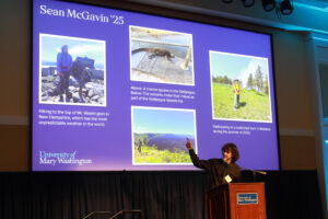 Sean McGavin '25 points out photos from his college journey on a slideshow presentation. Photo by Karen Pearlman.