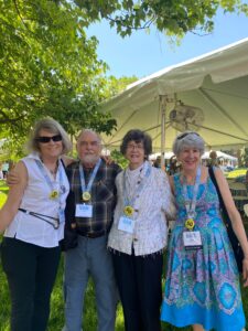 Dr. Bass and wife Heather (center) with Mary Saunders Williams (left) and Nancy Mahone Miller (right) from the Class of 1972, which established the Dr. Michael Bass Scholarship in his honor. Dr. Bass served as the freshmen class sponsor for the Class of 1972. Photo courtesy of Nancy Mahone Miller.