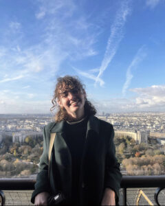 Hayley poses for a photo while visiting the Eiffel Tower. Photo courtesy of Hayley Madden.