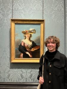 Senior Hayley Madden, an art history major at the University of Mary Washington, has studied abroad in both England and France because of the private support she has received from UMW donors. Here, she poses with a painting by Élisabeth Vigée Le Brun, 'Self-Portrait with a Straw Hat,' which she presented her research on at London's National Gallery of Art. Photo courtesy of Hayley Madden.