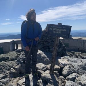 A photo of Sean hiking to the top of Mt. Washington in New Hampshire, which has some of the most unpredictable weather in the world. Photo courtesy of Sean McGavin.