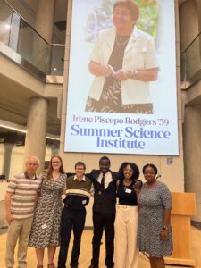 Aloysious (third from right) poses for a photo with his Department of Mathematics faculty mentors, Professors Melody Denhere and Leo Lee, and classmates after the Irene Piscopo Rodgers '59 Summer Science Institute Symposium in July 2024. Photo courtesy of Aloysious Kabonge.