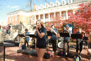 Mima performing with the UMW Pep Band in front of Lee Hall on Election Day. Her performances and recordings on Spotify showcase a wide range of influences like Elvis Presley, Michael Jackson, Amy Winehouse, Jessie J, and Dua Lipa. Photo courtesy of Mima Manton.