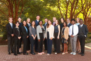 Mima (back row, right) and other members of the Student Alumni Ambassadors (SAA) pose for a photo outside the Jepson Alumni Executive Center. Mima serves as vice president of social media and marketing for the SAA program. Photo courtesy of Karen Pearlman.