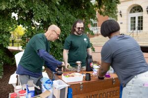 At this year's Devil-Goat Day, Ray and Devin served hot beverages from the recovery coffee bike, while providing outreach to the campus community about Eagles in Recovery and its mission. Photo by Parker Michel Boyce.