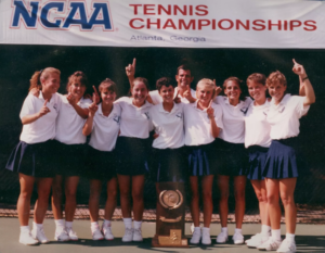 Christy (center, in front of trophy) with the rest of the Mary Washington women's tennis team and Coach Ed Hegmann at the NCAA Tennis Championships in 1991. Photo courtesy of Christy Copper.