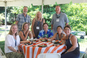1994 alumni enjoy the picnic on Ball Circle in 2024. The popular event includes barbecue fare, a children's playtime, and class photos on the Lee Hall steps. Photo by Karen Pearlman.
