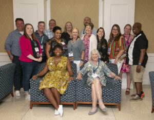 Past and present members of the Alumni Association Board of Directors pose for a photo with Executive Director of Alumni Engagement Mark Thaden ’02 (back row, far left) and Vice President for Advancement and Alumni Engagement and UMW Foundation Executive Director Katie Turcotte (back row, center left) at Reunion Weekend in 2024. Photo by Karen Pearlman.