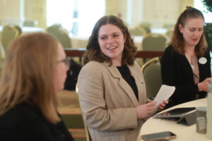 From left: Young Alumni Council members Megan Begley '22 and Hannah Harris '23 and Assistant Professor of Chemistry Sarah Smith '12, who serves as the faculty representative on the Alumni Board, chat between presentations. Photo by Karen Pearlman.