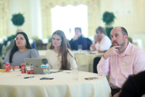 From right: Alumni Board member Brian Reagan '04 and Young Alumni Council members Mary-Elise Alworth '23 and Brooke Robertson '21 listen to the Fund for Mary Washington Impact Grant presentations. Photo by Karen Pearlman.