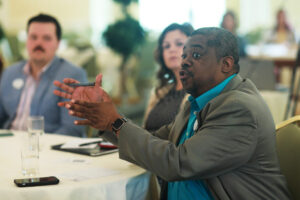 From right: Alumni Board member Sye Smith '96 asks a question of a presenter while Young Alumni Council member Melisa Levine '17 and YAC Vice Chair Reid Merritt '20 look on. Photo by Karen Pearlman.
