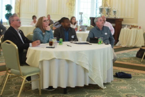 From left: Alumni Association Board of Directors President James Llewellyn '87, Vice President for Advancement and Alumni Engagement and UMW Foundation Executive Director Katie Turcotte, and Alumni Board members Harry Thomas '96 and Brendan Kelly '95 listen to presentations before awarding Fund for Mary Washington Impact Grants in April. Photo by Karen Pearlman.