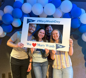 Young alumni pose for photos at the happy hour and trivia night on April 2, sponsored by the Fredericksburg Regional Alumni Network.