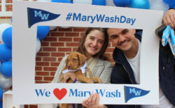 Student giving more than doubled from last year's event, and many participated in activities at the Mary Wash Day headquarters on the Cedric Rucker University Center patio on April 2. Here, two students take photos at the selfie station with a puppy brought to campus by Old Dominion Humane Society.