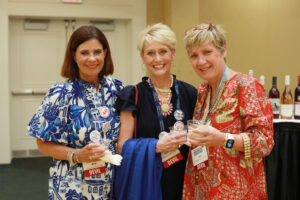 From left: 1985 graduates Kim Slayton White, Alison Metzger LaMura, and Cuff Gibbons Kunkel pose for a photo during the welcome reception. Typically held at Brompton, the event was moved to the Cedric Rucker University Center's Chandler Ballroom due to passing thunderstorms. Photo by Karen Pearlman.