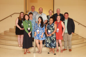 Executive Director of Alumni Engagement Mark Thaden '02 (front row, right) and members of the Alumni Association Board of Directors pose for a photo during the 2025 University of Mary Washington Reunion Weekend. Photo by Karen Pearlman.