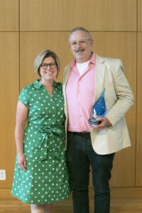 Rob Eastman-Mullins '00 poses for a photo with his wife, Andrea, after receiving the Distinguished Alumnus Award during Reunion Weekend. Photo by Karen Pearlman.