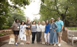Rachel Selle '05 (second from left) and fellow 2005 alumni join 1980 alumni for a photo on Campus Walk during Reunion Weekend. This year's event celebrated classes ending in 0 and 5, but all graduates are welcome to participate in the annual celebration held at the end of May. Photo by Karen Pearlman.