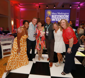 From left to right: Mary Washington alumni Karmel James ’13, Sean Lynch ’95, Vicki Sprague Ravenel ’77, and Alumni Association Board of Directors President James Llewellyn ’87 join Kelly Paino, wife of UMW President Troy Paino, and Vice President for Advancement and Alumni Engagement and UMW Foundation Executive Director Katie Turcotte during the 2025 Reunion Weekend. Photo by Karen Pearlman.