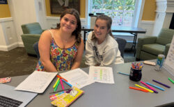 UMW first-year student Lucy Rabung (left) sought the help of her peer mentor, Lauren Spagnuolo, a sophomore, who helped her organize all her syllabi and record the dates of her assignments in a new day planner, provided by LaunchPad.