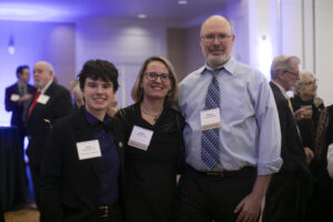 A college student (left) with their mother and father at the 2025 Celebration of Giving.