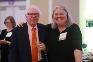 Distinguished Professor Emeritus of History William Crawley and a guest, Trenda Powell Jacocks '82.