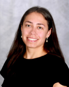 Photo of student smiling at the camera.