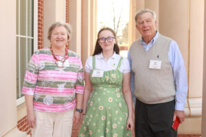 A student and two donors outside the Cedric Rucker University Center.
