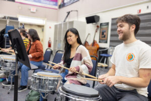 Several UMW students playing percussion instruments.
