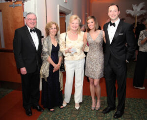 A group photo of five donors in formal dress.