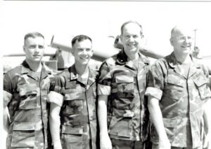 A photo of Sallie Galloway Gill's husband, brother-in-law, nephew, and son, all in their military fatigues.